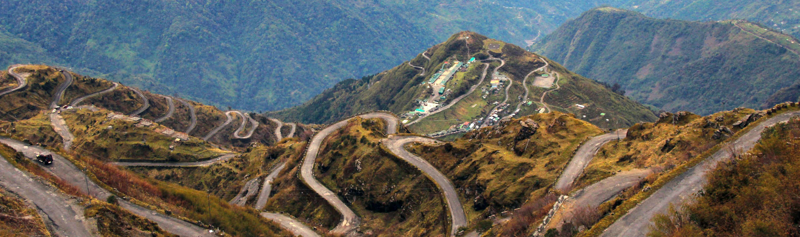 https://unsplash.com/photos/bird-eye-view-photography-of-roads-on-hil-pQ04riRO9wM