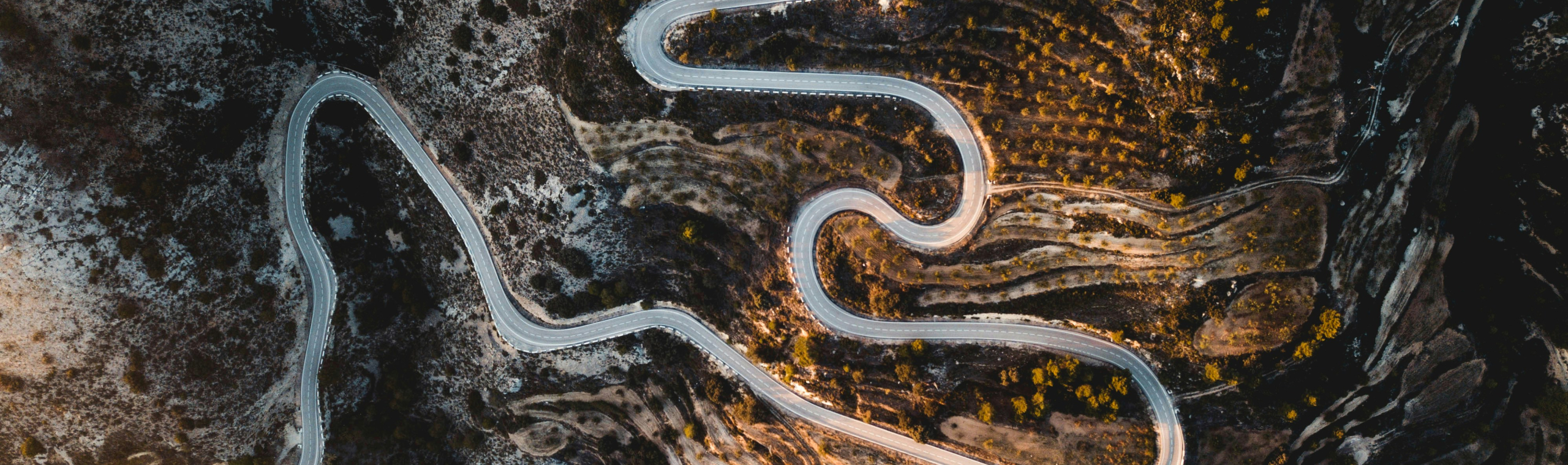https://unsplash.com/photos/aerial-photography-of-road-zS4lUqLEiNA